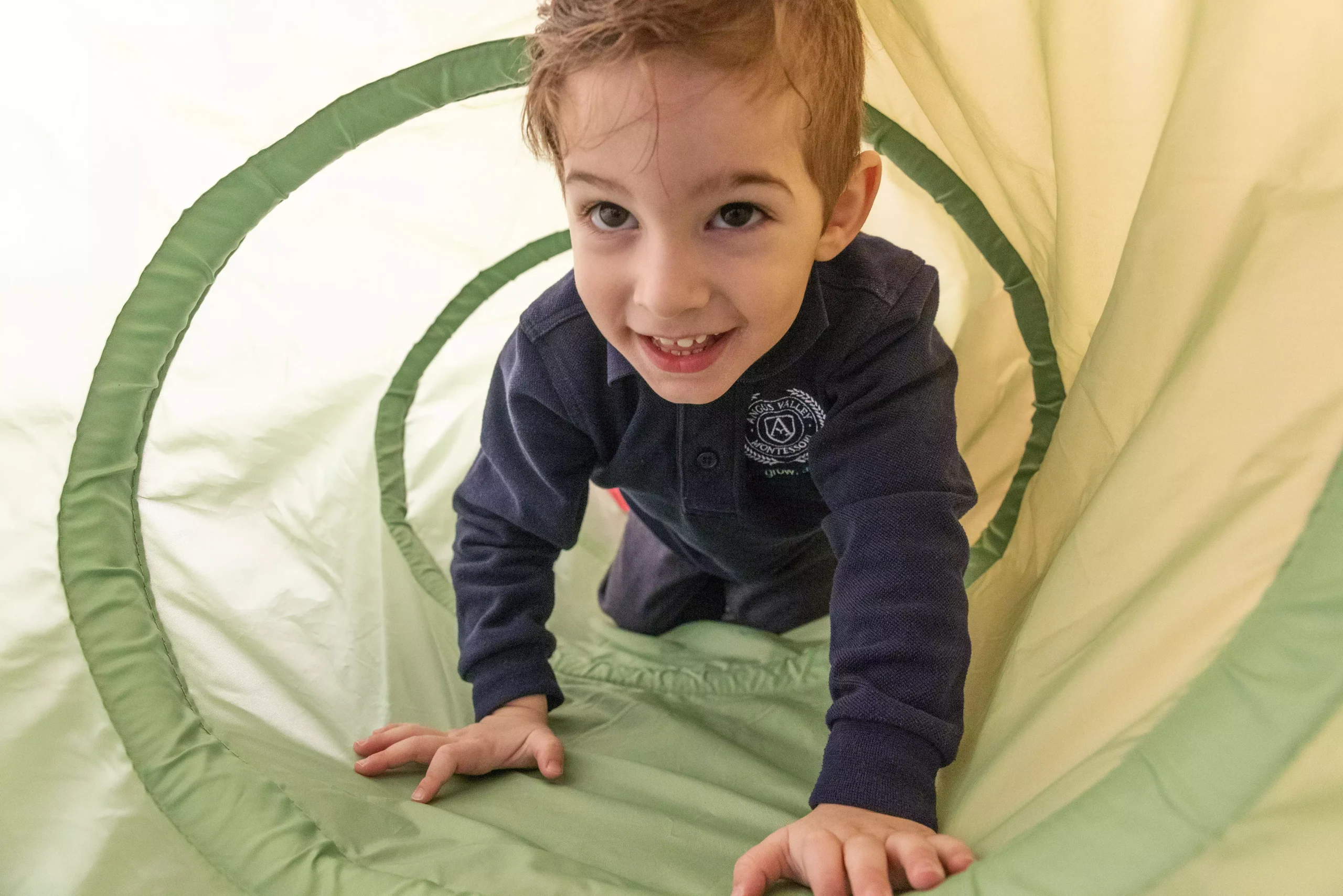 ALT "Young boy enjoys tunnel play"